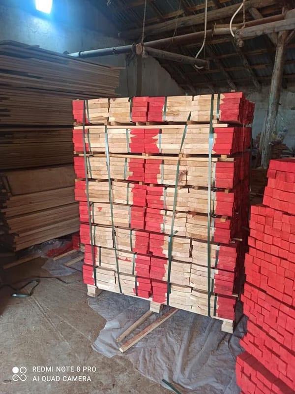 Wooden stakes with red-painted heads, on a pallet